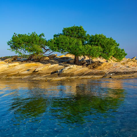Take the twenty-minute walk to Myrsini Beach and swim in the crystal clear waters
