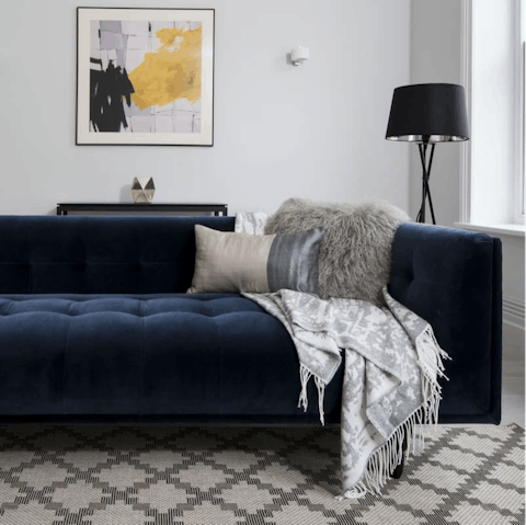Make yourself comfortable on the plush sofa
