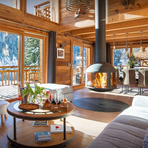 Enjoy a glass of wine around the hanging fireplace