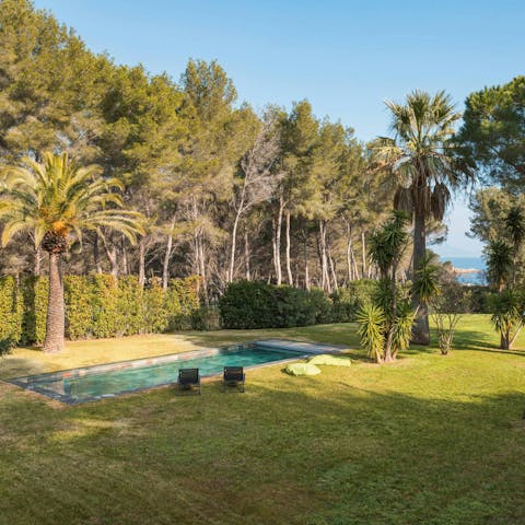 Admire Mediterranean Sea views from the lush garden