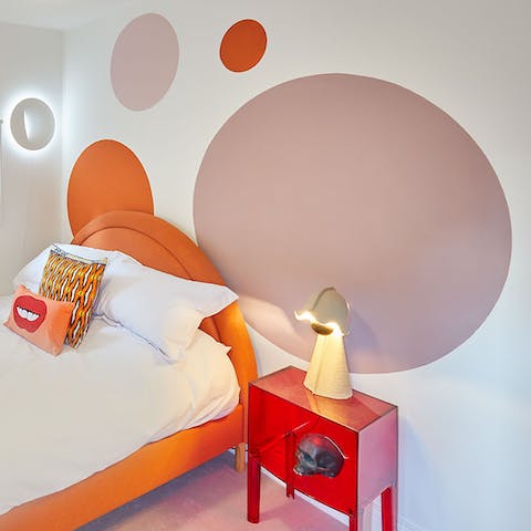 Wake up refreshed in your playfully hued bedroom