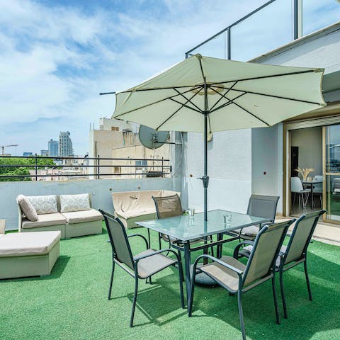 Spend warm evenings on the cosy rooftop terrace with a few glasses of arak