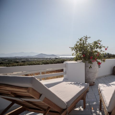 Stretch out on a lounger and admire the stunning views in style