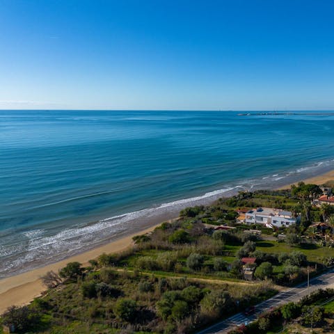 Sprawl out on Pozzallo's sandy beach, a short walk away
