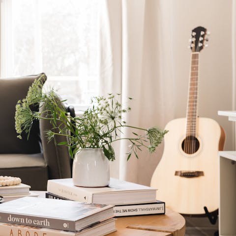 Practise your chords on the acoustic guitar