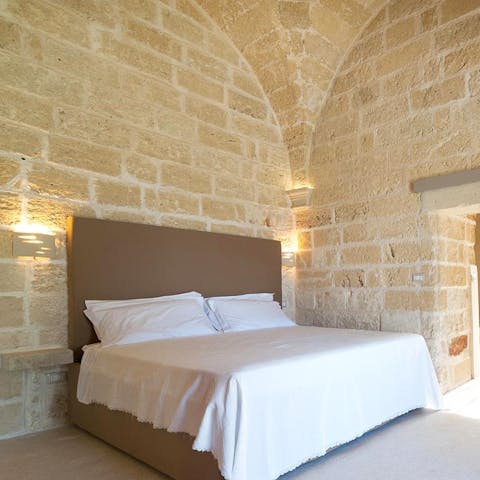 Lie in bed looking up at the original vaulted ceiling