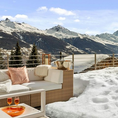 Appreciate the views with an après ski drink on the terrace