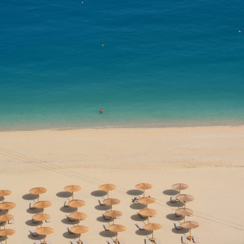 Take the fifteen-minute walk down a direct footpath to gorgeous Lourdas beach