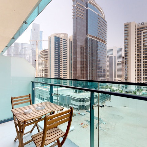 Relax on the private balcony after a busy day in the city