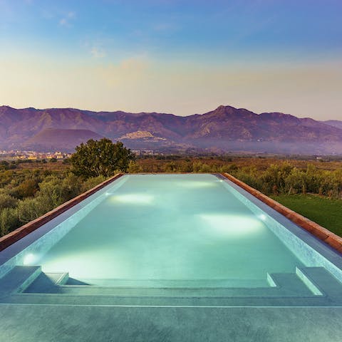 Watch the wildly beautiful sunset from beside the pool, enjoying a gin & tonic, garnished with Sicilian citrus
