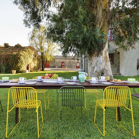 Gather around the outdoor dining table for a hearty family breakfast, preparing you for the day ahead