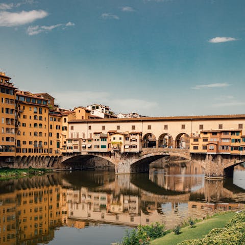 Meander across Ponte Vecchio with a gelato