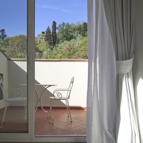 Enjoy your morning coffee on the balcony and admire views of the gardens