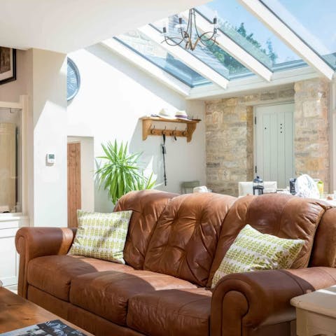 Bask in the light-filled living area with a glass of wine