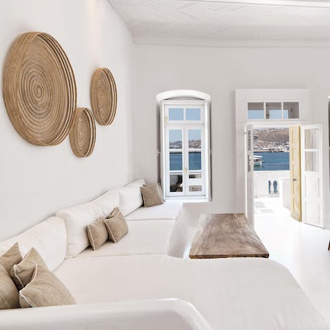 Sprawl out in the chic, whitewashed living room for a Netflix movie night