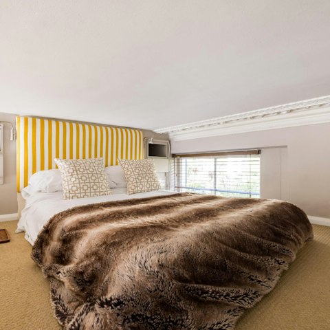 Sink into the sumptuous bed after a day of London sightseeing