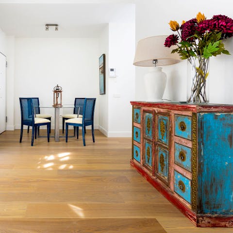 Dine together in the sociable living room with pops of colour