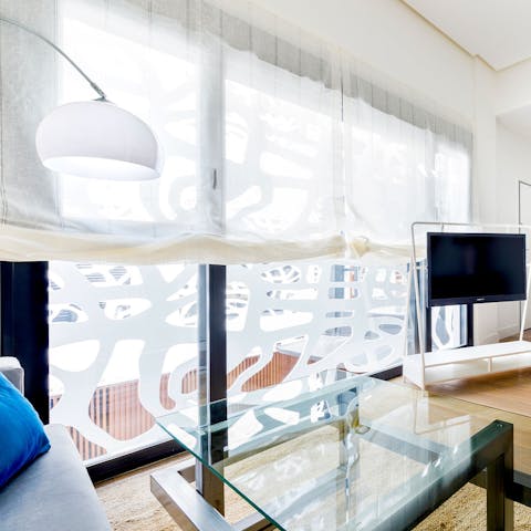 Admire the contemporary architecture of the building, with 'webbing' across the windows facing the courtyard