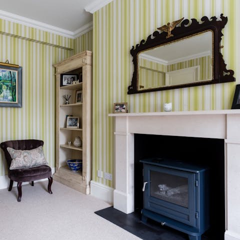 Curl up around the rustic log burning stove for a cosy evening in
