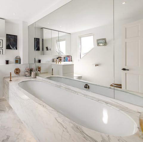 Spend a relaxing hour soaking in the marble tub