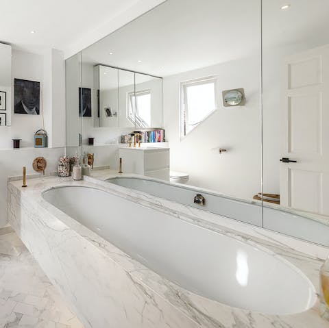 Spend a relaxing hour soaking in the marble tub