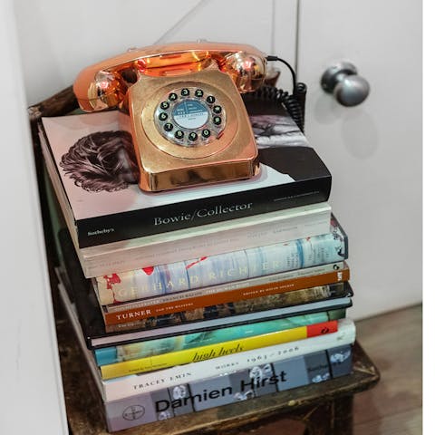 Admire the home's curated art and book collection