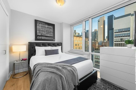 Wake to city views through floor-to-ceiling windows