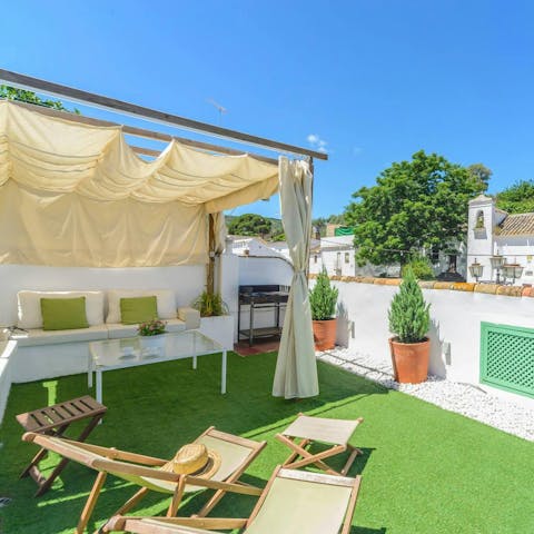 Relax on the roof terrace beneath the Andalusian sunshine