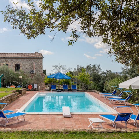 Relax with a good book by the private pool