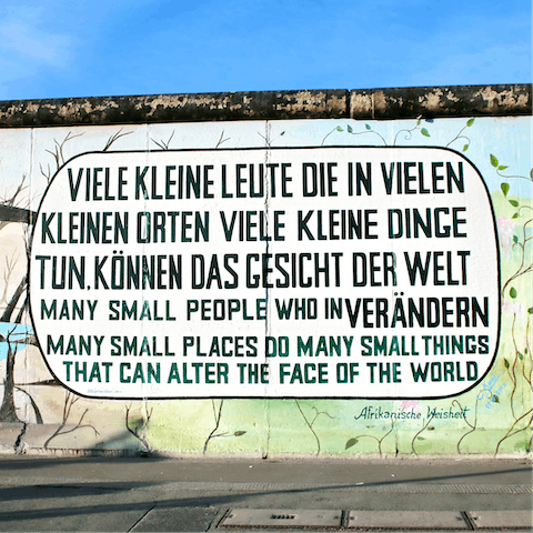 Explore East Side Gallery's art on the banks of the Spree, a twenty-minute walk away