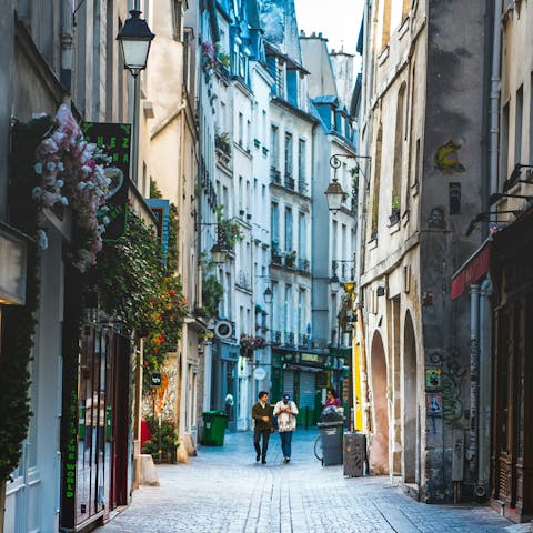Stroll across the river and explore the Marais district