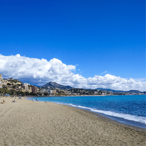 Treat yourself to an afternoon at Malagueta Beach, a quarter of an hour away on foot