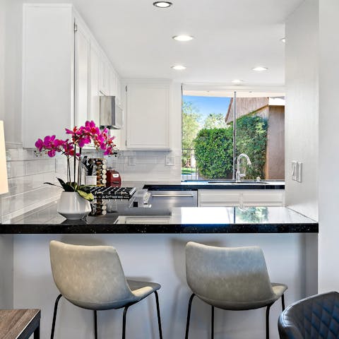 Enjoy morning coffees at the sleek breakfast bar