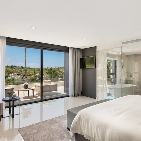 Wake up to breathtaking views from the main en-suite bedroom