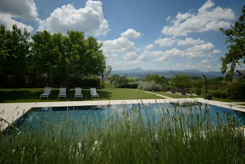 Swim in the pool with rolling countryside stretching beyond