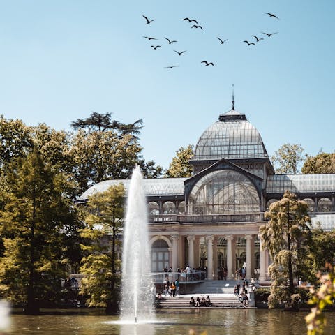 Take a refreshing stroll through El Retiro Park – just an eleven–minute walk away