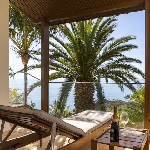 Open a bottle of fizz and watch a fantastic sunset on the balcony