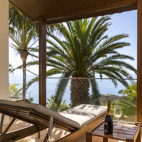 Open a bottle of fizz and watch a fantastic sunset on the balcony