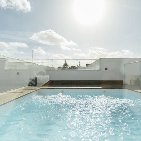 Relax in the rooftop swimming pool under the Spanish sun