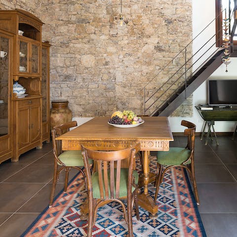 Gather round the country-style dining table for relaxed dinners at home