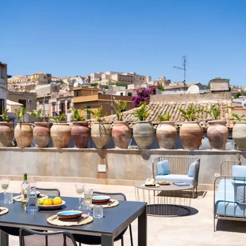 Take in the vistas of Noto at sunset from the terrace