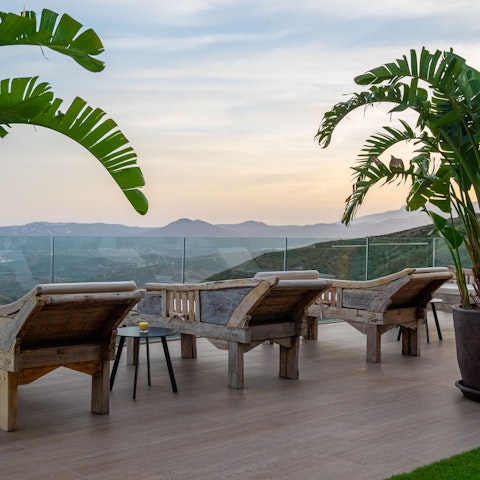 Catch the sunset from the day beds overlooking the majestic Mijas mountains