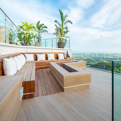 Gather around the fire pit with a glass of Spanish wine in hand