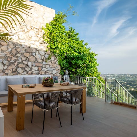 Dine alfresco while soaking up the luscious vistas and surrounding Mediterranean natural beauty