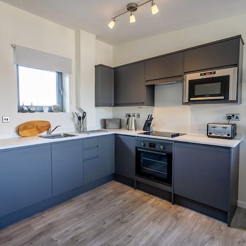 Rustle up breakfast in the sleek, modern kitchen