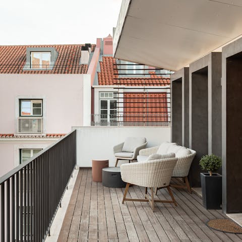 Unwind on the balcony with a glass of Vinho Verde