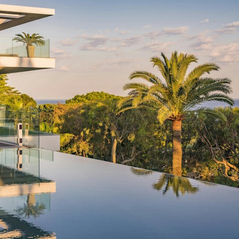 Admire the views from the luxurious infinity pool