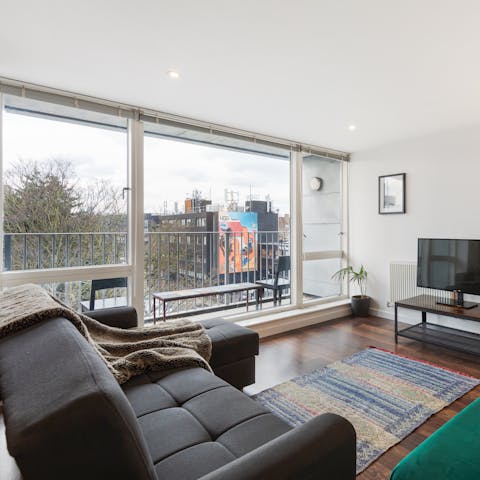 Enjoy the views from the balcony or the living room