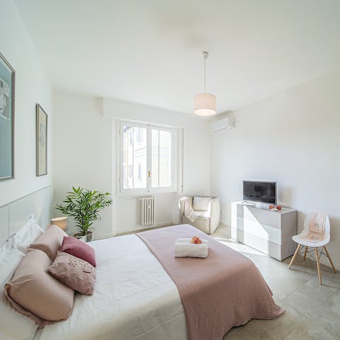 Wake up in the calming pink bedroom, feeling rested and excited to explore