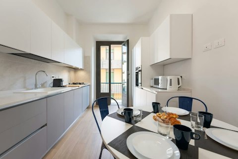 Cook and eat in a light-filled kitchen with balcony access